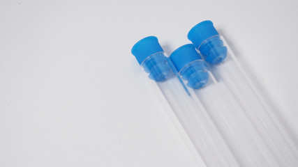 Three Empty test tubes on white background.
