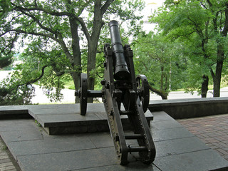 Old cast-iron cannon in Chernihiv in the park on a summer day