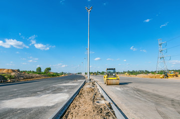 Construction site of the wide highway at day time.