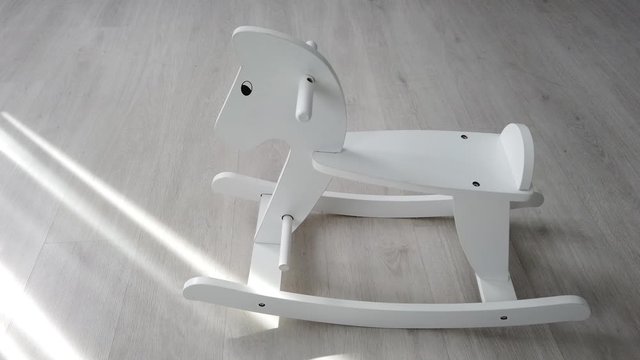 lonely rocking hourse in apartment