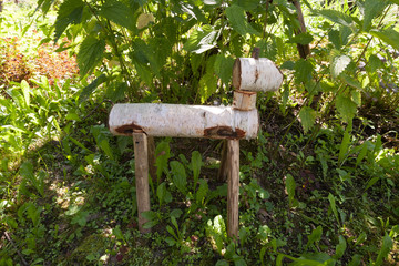 Wooden animal from birch in the bush