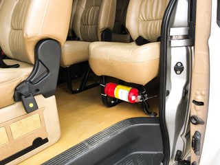 Fire extinguisher on public transport van and installation at the car seats cover
