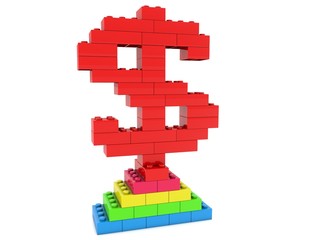 Dollar sign made of red toy bricks at the top of the pyramid