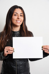 beautiful smiling brunette girl with placard