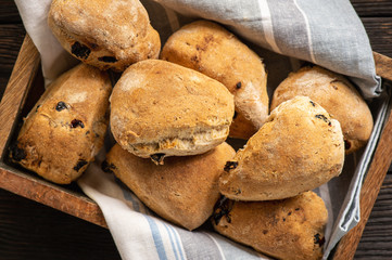 Homemade whole wheat bread buns with raisins.