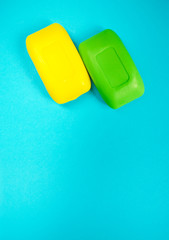 Soap bar on blue background with copy space. Health care and hygiene.
