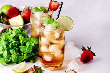 Glasses of Cold Citrus and Strawberry Ice Tea Decorated with Slice of Lemon and Strawberry Healthy Summer Drink Horizontal
