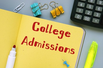 Business concept meaning College Admissions with inscription on the sheet.