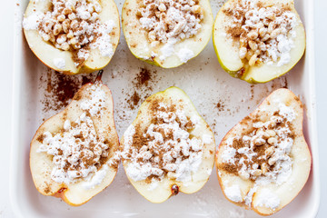 Stuffed pears dessert in white baking dish