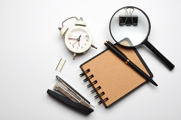 School note and supplies on a white background. Back to school, home creative workspace