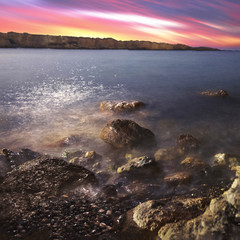 Sunset rocks in the water