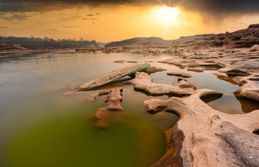 A local fishing boat is waiting for the water upstream of the Mekong River to wait for the time to...