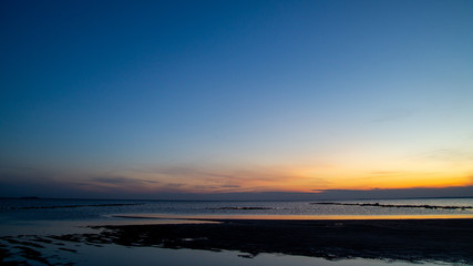 Sunset on the sandy beach, beach, beautiful sky, dramatic sky.