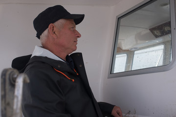 Portrait of a captain in his boat's cabin © viktor holm