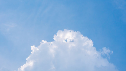Beautiful clouds in blue sky background. Puffy and brilliant white clouds before sunset. Sky and clouds background