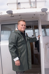 Portrait of a captain in his boat's cabin