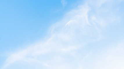 Beautiful clouds in blue sky background. Puffy and brilliant white clouds before sunset. Sky and clouds background