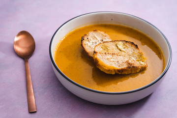 plant-based food, vegan carrot onion and celeri soup with homemade bread