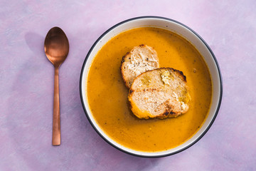 plant-based food, vegan carrot onion and celeri soup with homemade bread
