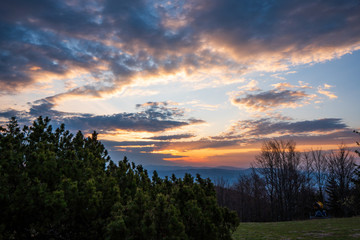 sunrise in the mountains with forest in the foreground with beautiful sky, czech republic beskydy Javorovy vrch