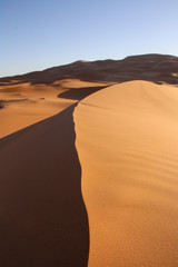 Fototapeta na wymiar Sand dunes at a sunset in Morocco