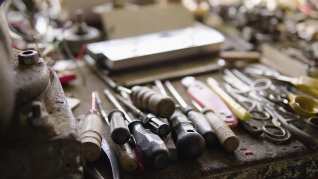 A table with DIY equipment in a workshop - closeup