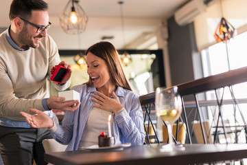 Husband giving wife a birthday present