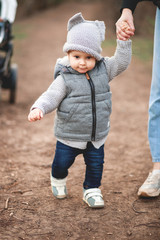 Fototapeta premium Mother and son walk in the spring Park