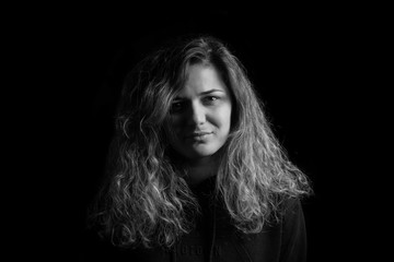Fototapeta premium a beautiful girl portrait on black background black and white