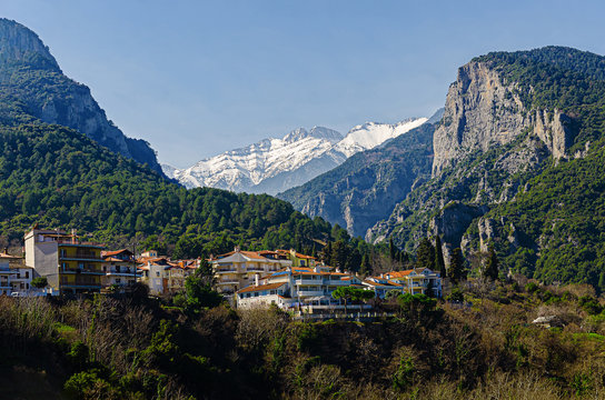Beautiful view of the mountains of Olympus from an observation deck in the center of Litochoro. High rocky green mountains and snow-capped peaks.