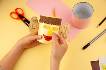 Step 22. Step-by-step instructions on how to make a stand for stationery from recycled materials....