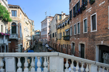 Fototapeta na wymiar Typical view of a venetian canal street on a sunny summer day. Venice, Italy