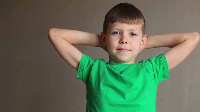 Mom boy cuts his nails with scissors. The child is cut nails