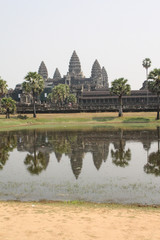 Fototapeta na wymiar Angkor Wat is reflected in a lake
