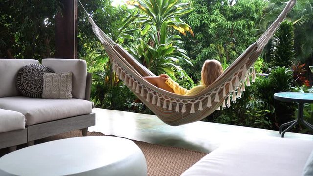 Woman on a vacation relaxing in the hammock