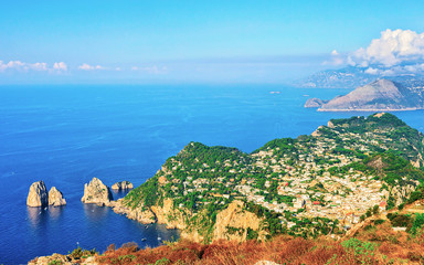 Faraglioni cliffs in Tyrrhenian Sea of Capri Island reflex