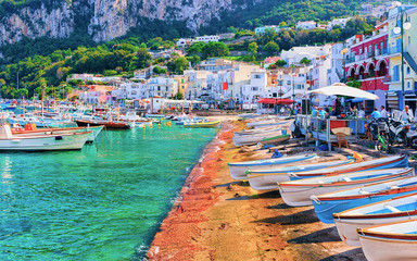 Boats at Marina Grande embankment in Capri Island Tyrrhenian sea reflex