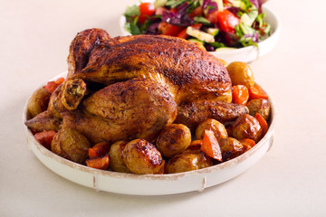 Roast chicken with potatoes and carrot