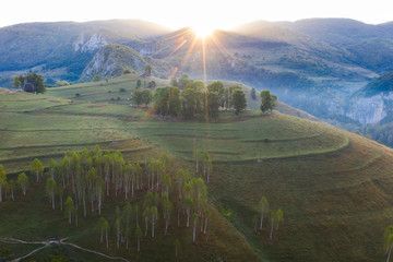 Drone view of beautiful summer sunrise over Transylvanian mountains.