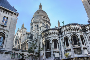 Cathedral of the Sacre Coeur. The dome, arches, balustrades, and mullioned Windows. France. Paris. Grey.
