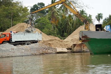 Fototapeta na wymiar construction area at a natural river in vietnam