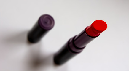 Matte lipstick red on a white background 