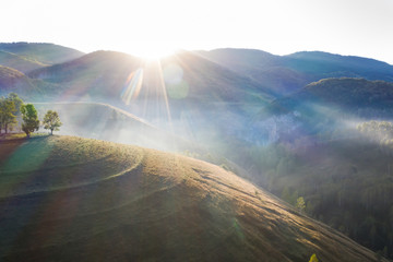 Drone view of beautiful summer sunrise over Transylvanian mountains.