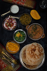Noth Indian vegetarian dishes on dark table