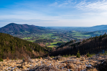 view to the valley in the mountains with a beautiful village and field in the spring, Czech Beskydy Celadna