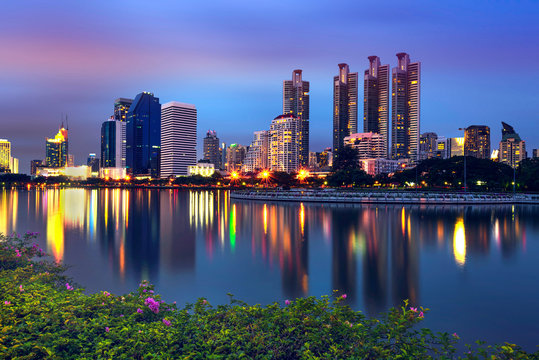 Nightlife in Bangkok, Cityscape photography of Benchakitti Park at twilight in Bangkok, Thailand. , Outdoor evening landscape of modern Bangkok city skyscrapers, Asia. Beautiful modern Bangkok city.