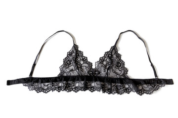 Close-up of a sexy black see-through lacy bralette bra, isolated on white background.