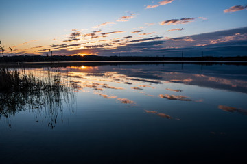 morning lake with sunrise and cloud reflection, czech karvina