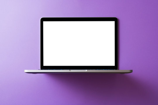 Laptop with blank screen mockup concept. Creative workspace background.