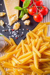 concept of traditional italian pasta with tomatoes and basil